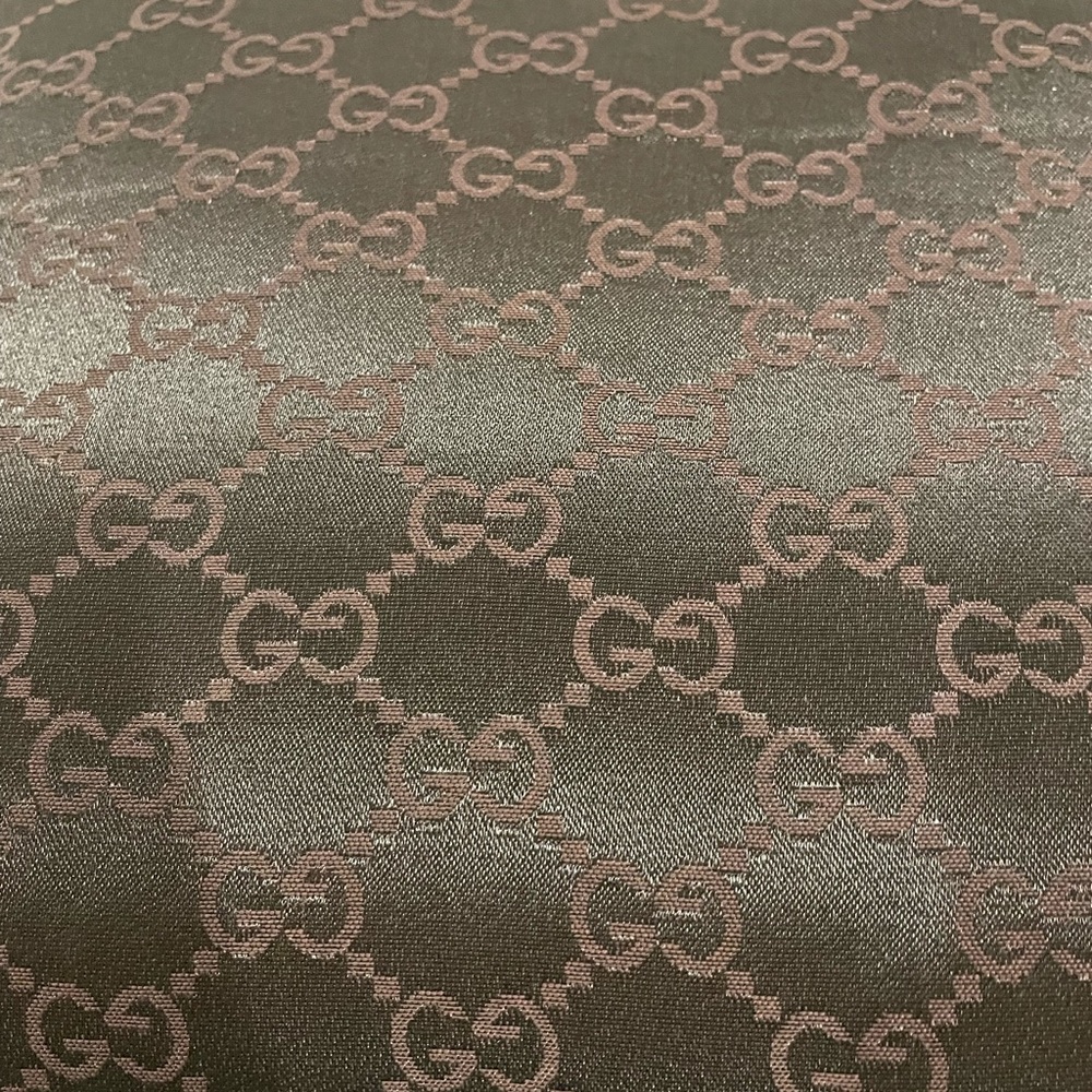 GG accent pillow. 18” x 18”. Made from a GUCCI handbag dustbag.
